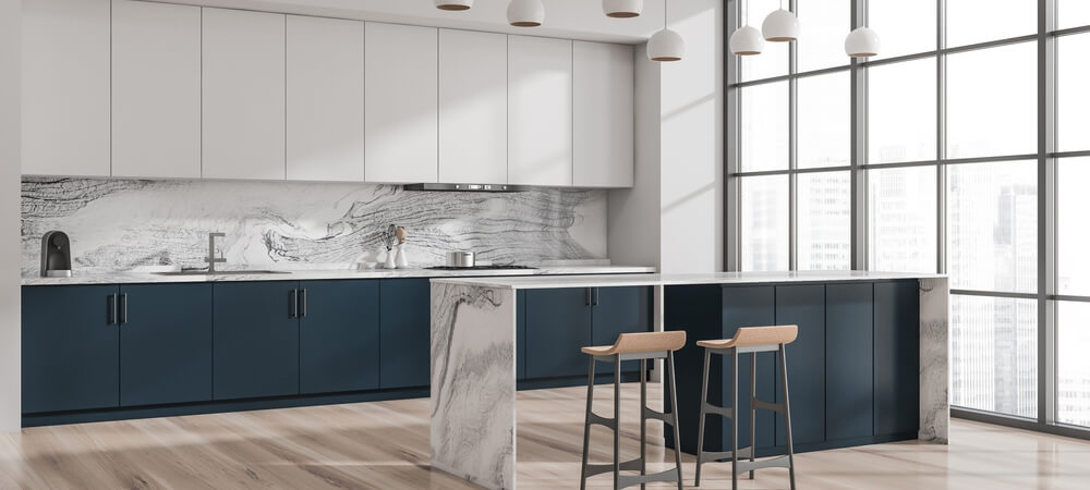 Kitchen design with two-tone cabinetry—Trenton Ivory uppers and Sage base cabinets