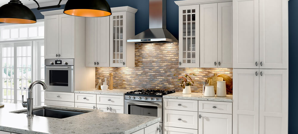 Trenton Ivory cabinets in a transitional kitchen with gold hardware and wood accents